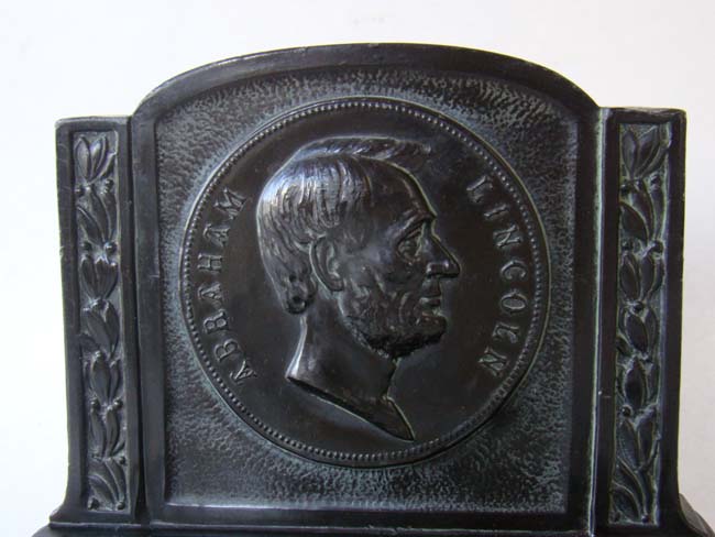 An attractive and rare pair of Abraham Lincoln profile bookends made by L.V. Aronson in 1921 — image 2